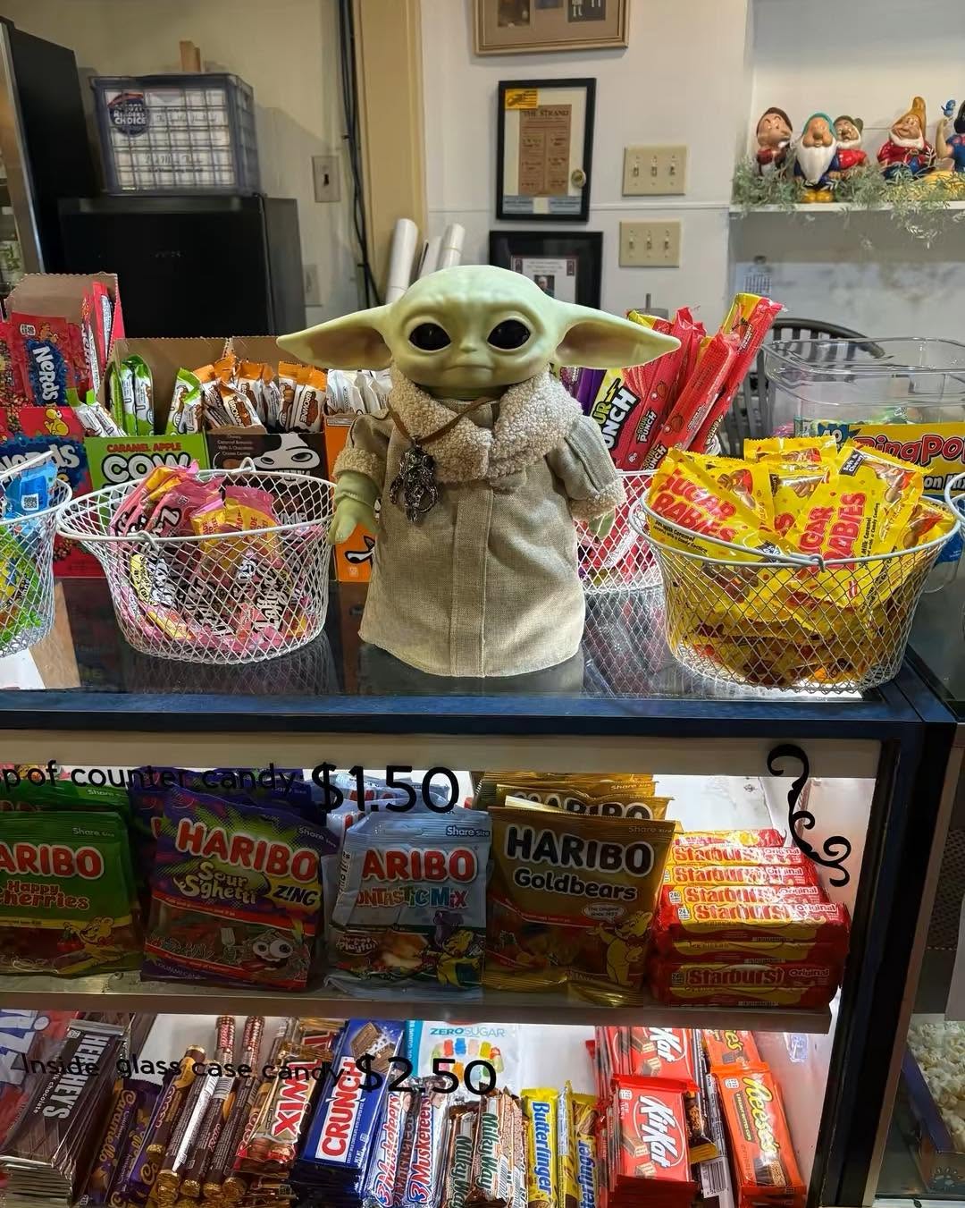 grogu doll at the concession stand to promote the mandalorian and grogu movie